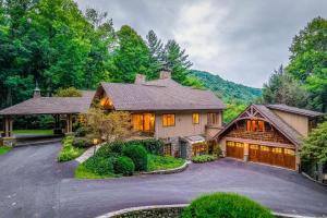 a home in the mountains with a driveway at Eagles Nest at Big Bear Estates in Waynesville