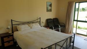 Llit o llits en una habitació de Bahara Accommodation