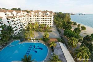 an aerial view of a resort with a swimming pool and the ocean at Bayu Beach Resort Apartment Seaview Private Beach in Port Dickson