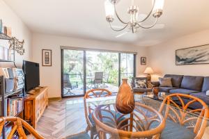 a living room with a couch and chairs at Maui Kamaole M104 in Wailea