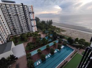 an aerial view of a hotel and the beach at TimurBay Seafront Holiday Pool & Seaview in Kuantan