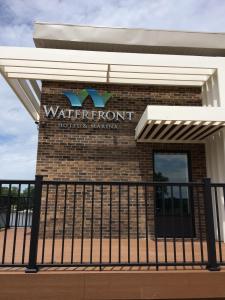 a sign for the water front of a building at Waterfront Hotel and Marina in Johnsburg