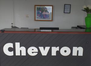 a chevron sign on top of a counter at Chevron Motel in Taupo