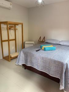 Ένα ή περισσότερα κρεβάτια σε δωμάτιο στο Suíte Peixe Espada