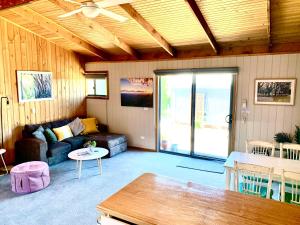 a living room with a couch and a table at No43 Studio apartment in Mount Beauty