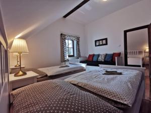 Postelja oz. postelje v sobi nastanitve Apartmány Rožmberk
