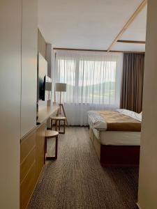 Hotel Adamantino客房内的一张或多张床位