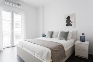 Un pat sau paturi într-o cameră la Industrial 1BR Apartment in Ampelokipoi Area by UPSTREET