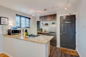 a kitchen with a counter top and a refrigerator at Nashville Flat w/View Walkable -207 in Nashville