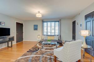 a living room with a couch and a table at Nashville Flat w/View Walkable -207 in Nashville