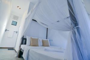 Ένα ή περισσότερα κρεβάτια σε δωμάτιο στο SUNSET Cabana