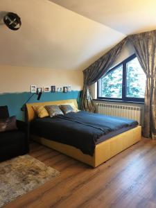 A bed or beds in a room at Borovets Forest view (A56)
