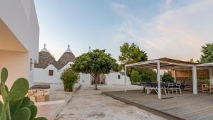 A patio or other outdoor area at TRULLO SANTA PAZIENZA 6&3, Emma Villas