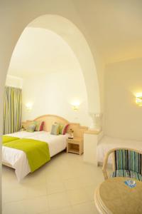 Un pat sau paturi într-o cameră la One Resort Aqua Park