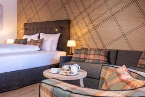 Łóżko lub łóżka w pokoju w obiekcie Defereggental Hotel & Resort