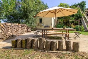Vonkajšia záhrada v ubytovaní MASÍA CAN GRAU habitaciones con desayuno inlcuido