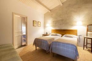 Posteľ alebo postele v izbe v ubytovaní MASÍA CAN GRAU habitaciones con desayuno inlcuido