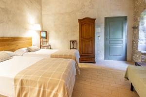 Posteľ alebo postele v izbe v ubytovaní MASÍA CAN GRAU habitaciones con desayuno inlcuido