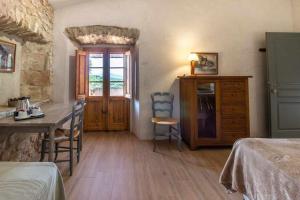 Posteľ alebo postele v izbe v ubytovaní MASÍA CAN GRAU habitaciones con desayuno inlcuido