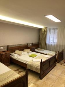 Postel nebo postele na pokoji v ubytování Mosoly Apartman
