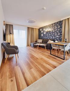 Televízia a/alebo spoločenská miestnosť v ubytovaní LAGUNA Apartament Polanica Residence 48