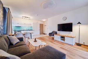 Televízia a/alebo spoločenská miestnosť v ubytovaní LAGUNA Apartament Polanica Residence 48
