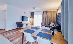 Televízia a/alebo spoločenská miestnosť v ubytovaní LAGUNA Apartament Polanica Residence 48