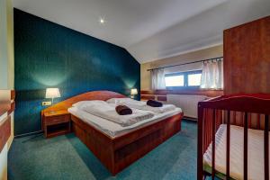 Postel nebo postele na pokoji v ubytování Apartmánový dom Slniečko + 37 fotografií