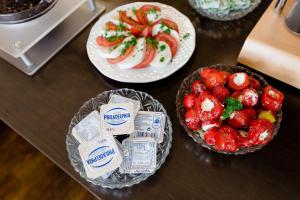 a table with two plates of food on top at Hotel Restaurant Zwergschlösschen in Gera