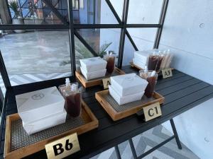 a table with three boxes of drinks on a balcony at 極の宿 eXtreme in Xiaoliuqiu