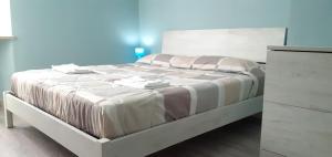 Łóżko lub łóżka w pokoju w obiekcie Casa vacanze Perfecta Laetitia Assisi