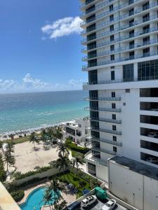 a view of the beach from the balcony of a building at Ocean view Hollywood in Hollywood