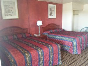 Cama o camas de una habitación en Encore Motel