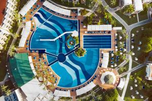 an overhead view of a swimming pool with a clock in it at TUI BLUE Tropical in Dalaman