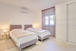 Posteľ alebo postele v izbe v ubytovaní Villa Buzdonka