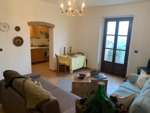 a living room with a couch and a table at Viaggio della Vita B&B in Fontanile