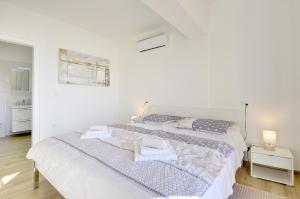 Posteľ alebo postele v izbe v ubytovaní Villa Buzdonka