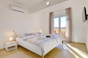 Posteľ alebo postele v izbe v ubytovaní Villa Buzdonka + 37 fotografií