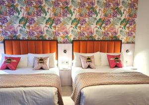 Voodi või voodid majutusasutuse Allingham Arms Hotel toas