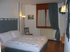 เตียงในห้องที่ Hotel La Caminatha