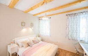 a bedroom with a bed and a window at Aldo Apartments Center in Zadar