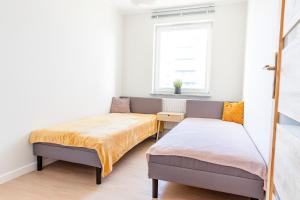Posteľ alebo postele v izbe v ubytovaní AL-DOM apartamenty Apartament Stjarne w spokojnej okolicy