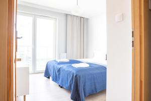 Posteľ alebo postele v izbe v ubytovaní AL-DOM apartamenty Apartament Stjarne w spokojnej okolicy
