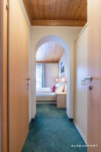 Кровать или кровати в номере Gasthof Alpensport