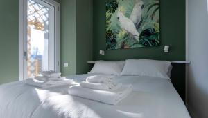 Un pat sau paturi într-o cameră la Italianway - Flavio Gioia 5