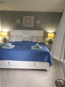 Postel nebo postele na pokoji v ubytování Lantana Barbados Condos