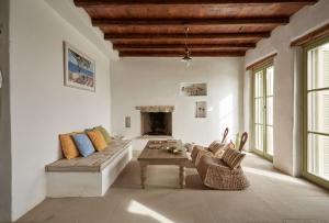 a living room with a couch and a table at Spacious 6 bdrm Stone Villa with Pool in Rámos