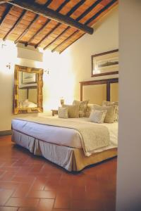 A bed or beds in a room at Capannelle Wine Resort