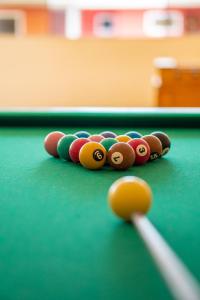 a group of cue balls on a pool table at Aquaville Apart Hotel in Porto Seguro