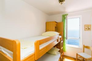 Postel nebo postele na pokoji v ubytování Apartment Gigi